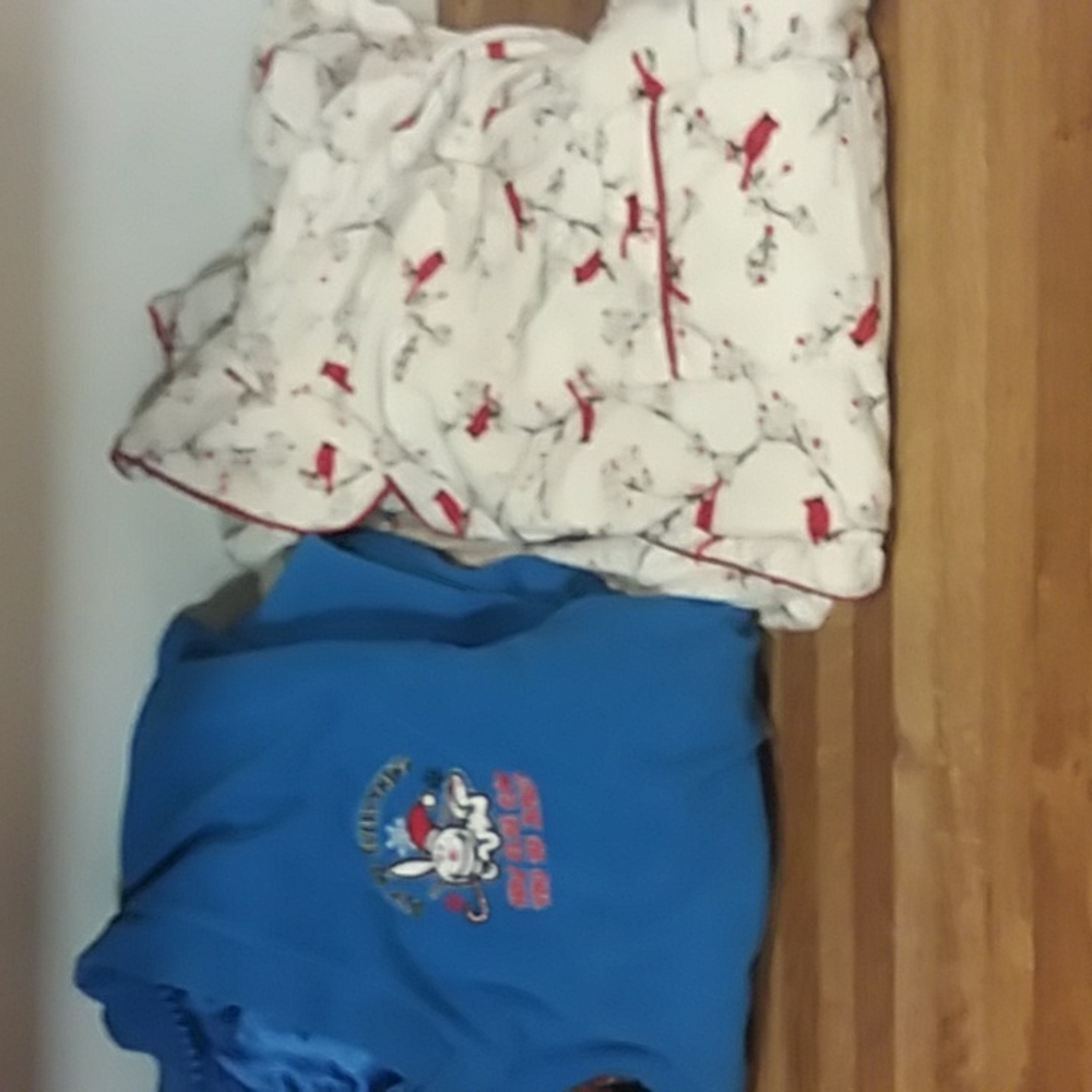 Red and white pajamas  and blue and black pajama top and buttons